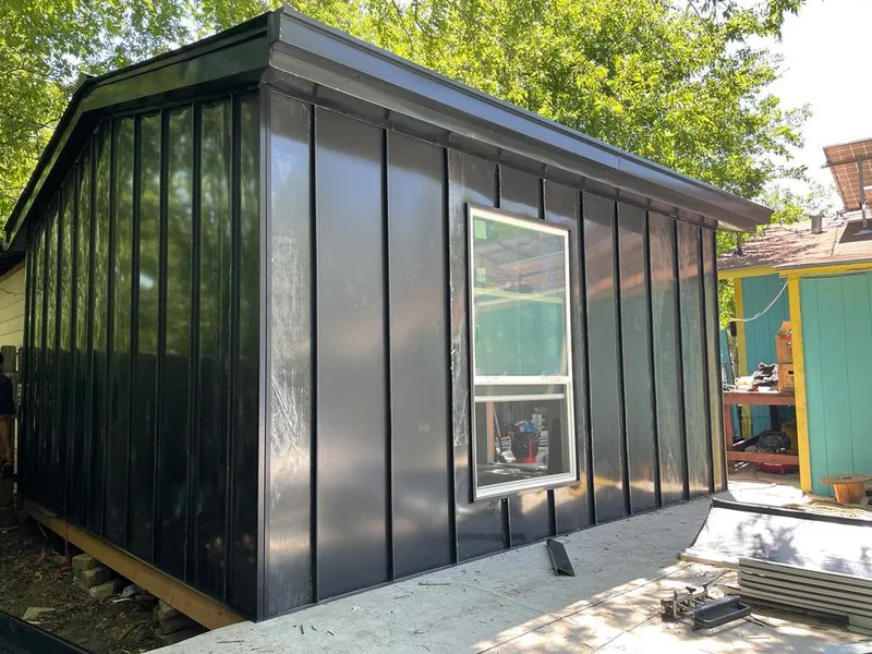 Black standing seam metal wall panels for Roof Inspection in Orrville